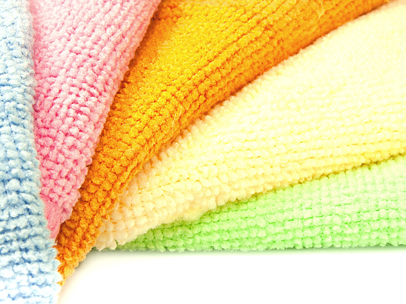 Picture of brightly colored microfiber cleaning cloths, sustainable swaps, zero waste swaps, sustainable swaps for home, earth friendly swaps, stainless steel water, water bottle, stainless steel, produce bags, dryer balls, dryer sheets, plastic cutlery, own reusable, tea bags, free, soap, straws, mentrual cup